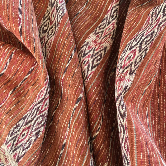 Vintage Indonesian Timor Biboki handwoven ikat textile in brick orange tone